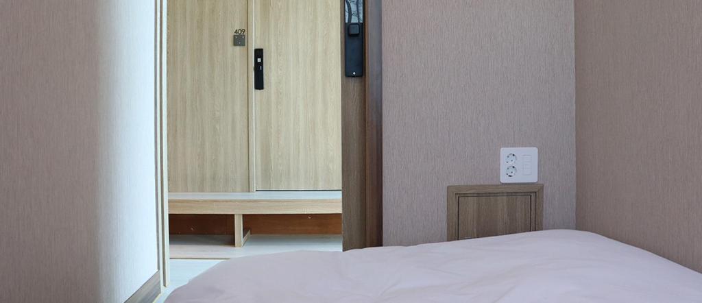 Postel nebo postele na pokoji v ubytování Hotel tt Gupo