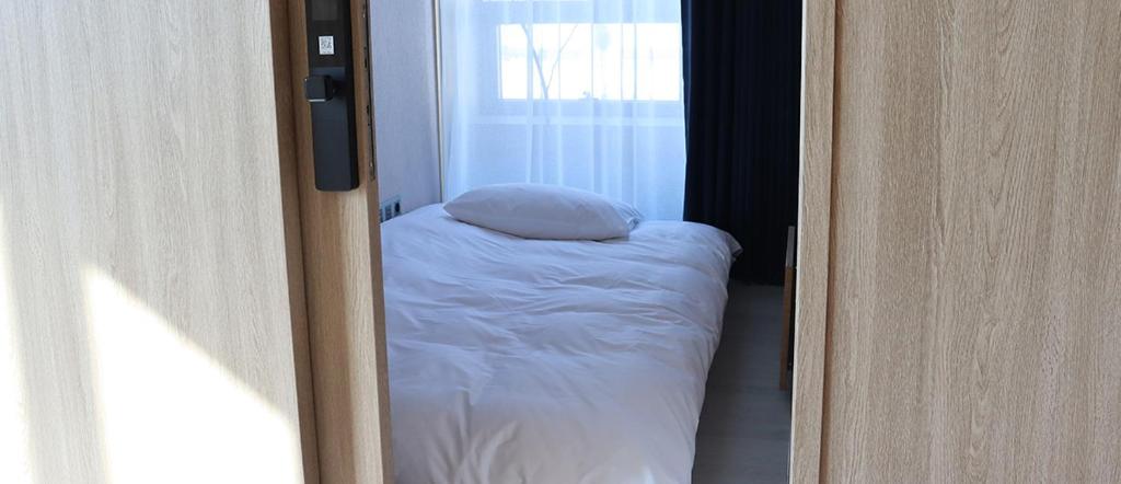 Postel nebo postele na pokoji v ubytování Hotel tt Gupo