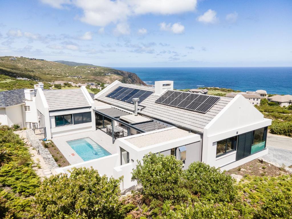 an image of a house with solar panels on the roof at Miles End Pezula in Knysna