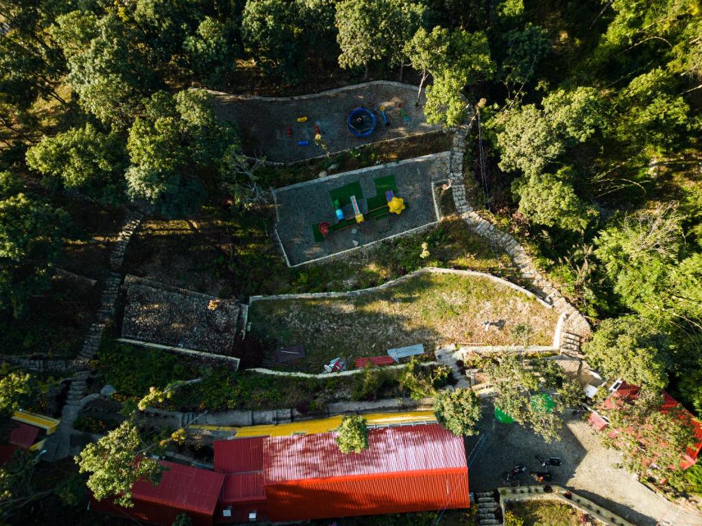 an overhead view of a house with a yard at Naya Gaun Eco Resort in Pokhara