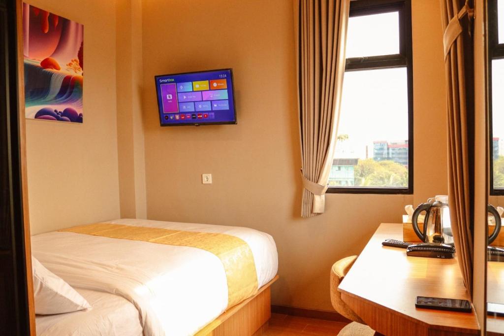 Postel nebo postele na pokoji v ubytování Grand Ametis Hotel Jakarta