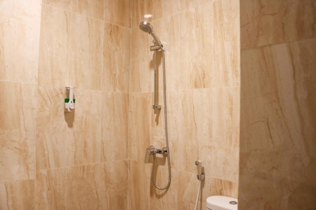 Koupelna v ubytování Grand Ametis Hotel Jakarta