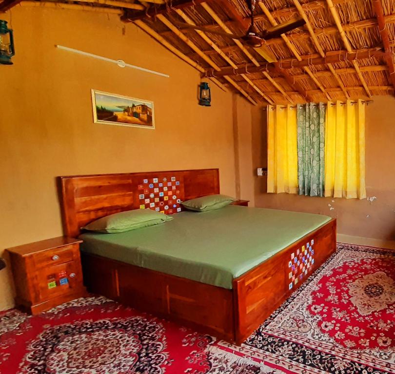 a bedroom with a large bed in a room at Vedic Life Homestay & Wellness Centre in Jaipur