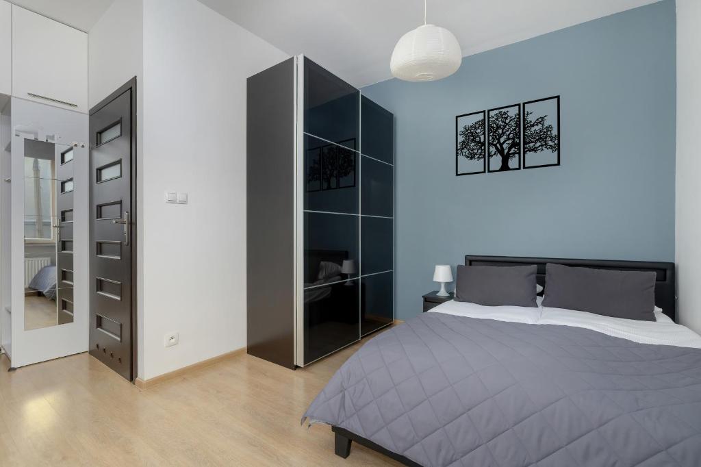Posteľ alebo postele v izbe v ubytovaní Lea Apartments Kraków Krowodrza by Noclegi Renters