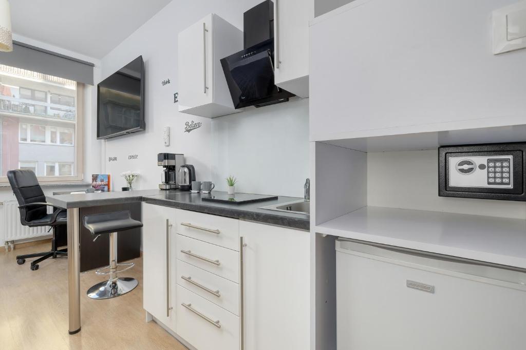 Kuchyňa alebo kuchynka v ubytovaní Lea Apartments Kraków Krowodrza by Noclegi Renters