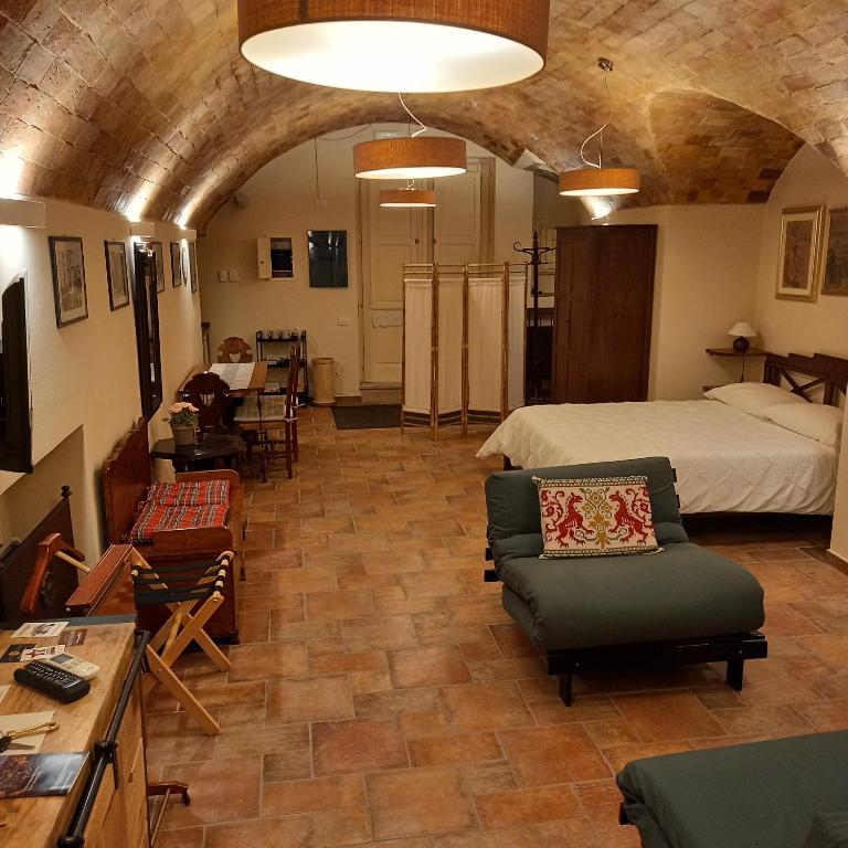 Postel nebo postele na pokoji v ubytování La Cisterna del Vicinato