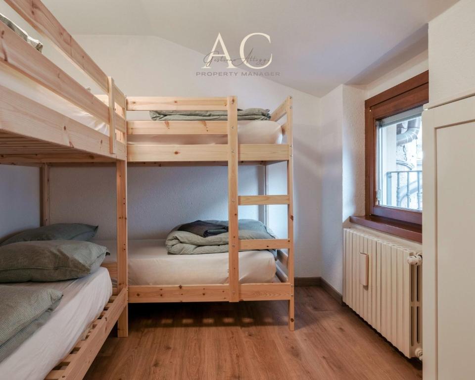 A bed or beds in a room at Square Apartment