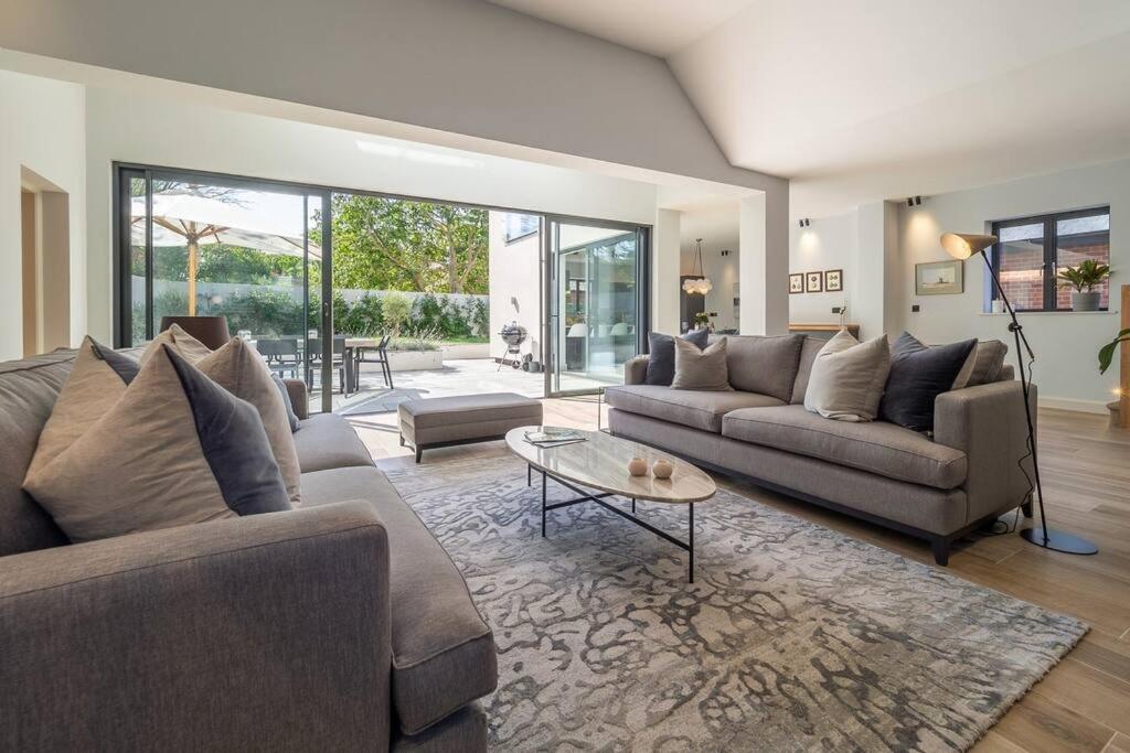 a living room with two couches and a table at Court House, Aldeburgh in Aldeburgh