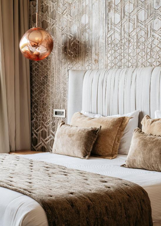 Una cama o camas en una habitación de Bavaro Beach Dakhla