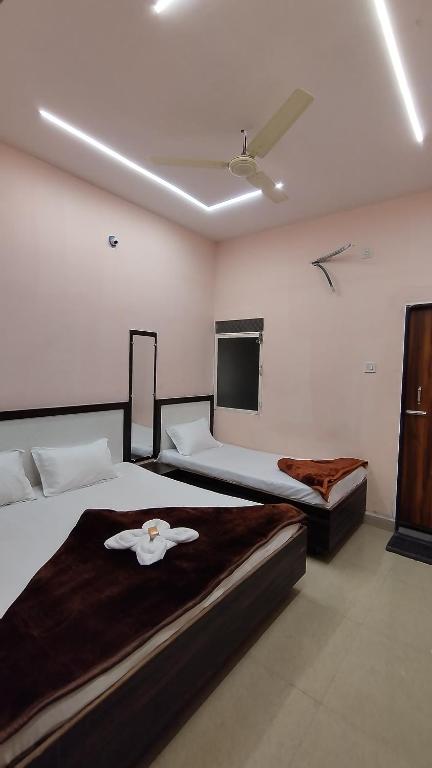Voodi või voodid majutusasutuse Shree Govindam Guest House toas