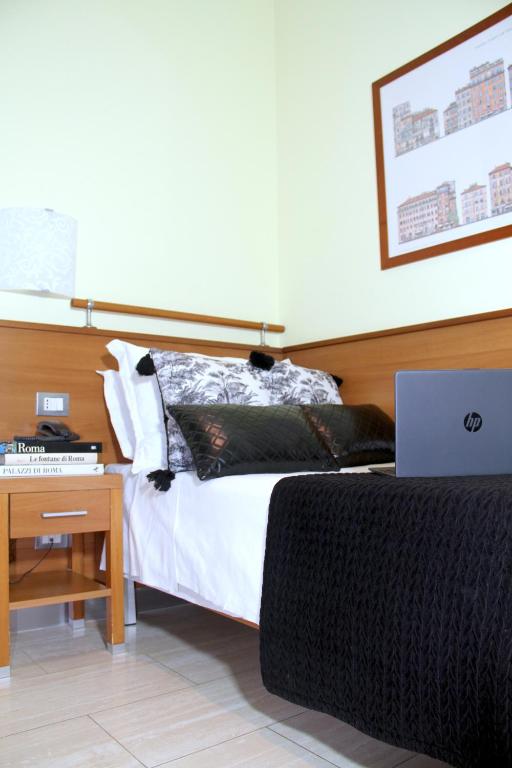 Postel nebo postele na pokoji v ubytování Hotel Windrose