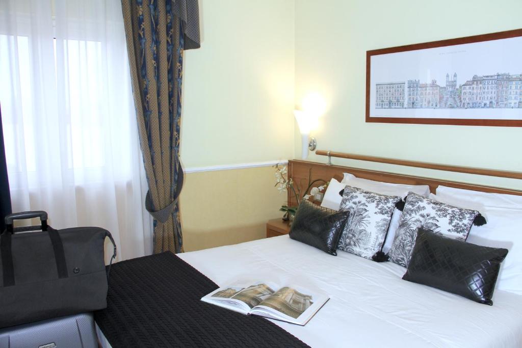 Postel nebo postele na pokoji v ubytování Hotel Windrose