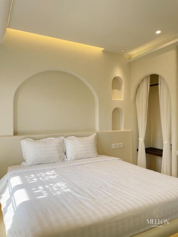 Giường trong phòng chung tại Mellon OASIS Phu Quoc