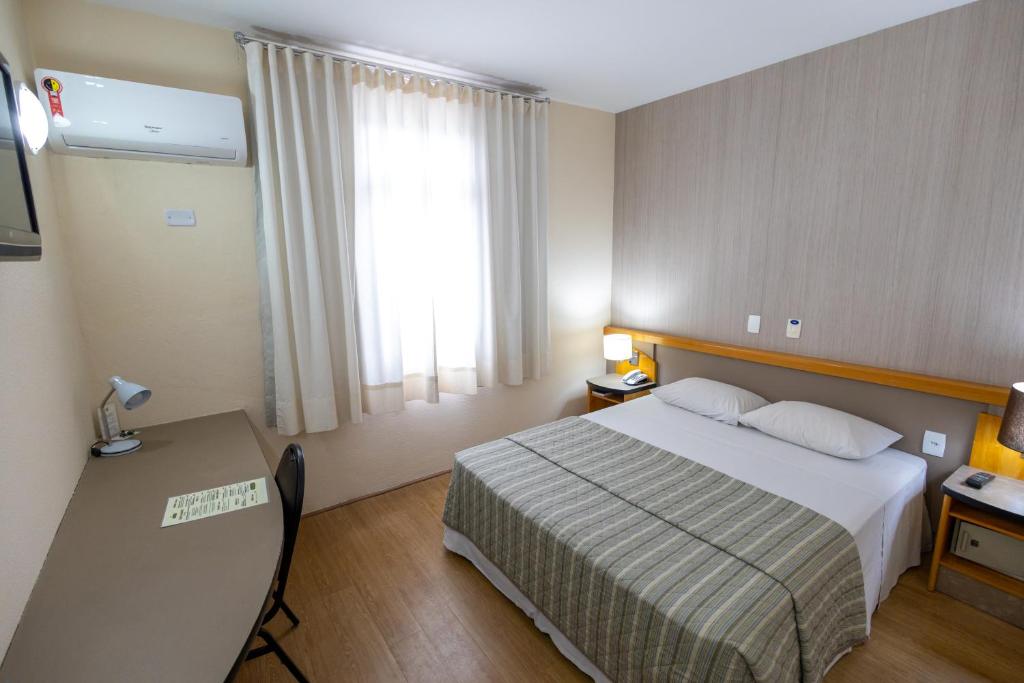 Postel nebo postele na pokoji v ubytování Sables Hotel Guarulhos