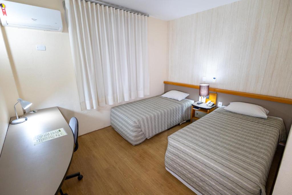 Postel nebo postele na pokoji v ubytování Sables Hotel Guarulhos