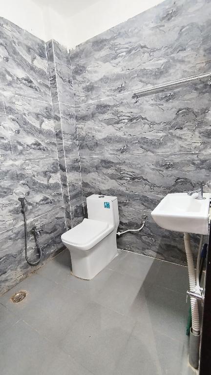 Vannituba majutusasutuses Shree Govindam Guest House