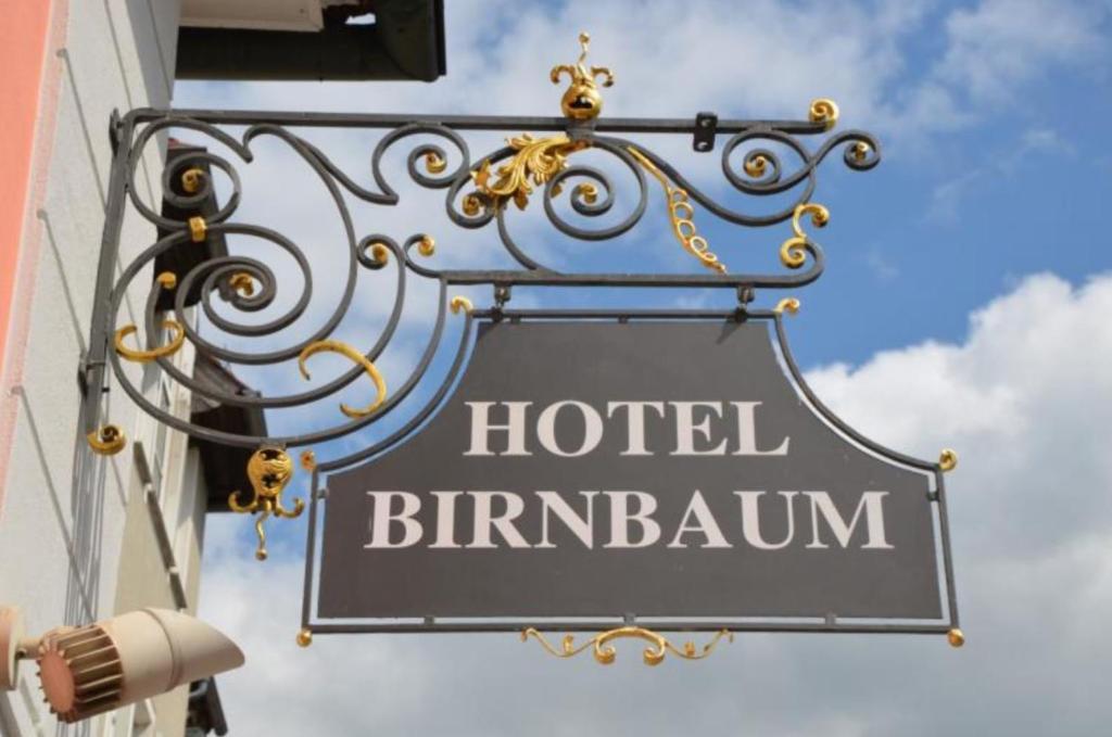 a sign for a hotel birmingham on the side of a building at Hotel Birnbaum in Ansbach
