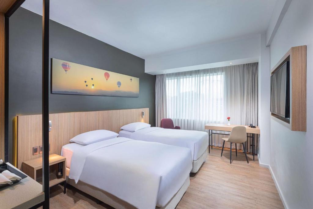 Postel nebo postele na pokoji v ubytování Park Inn By Radisson Clark
