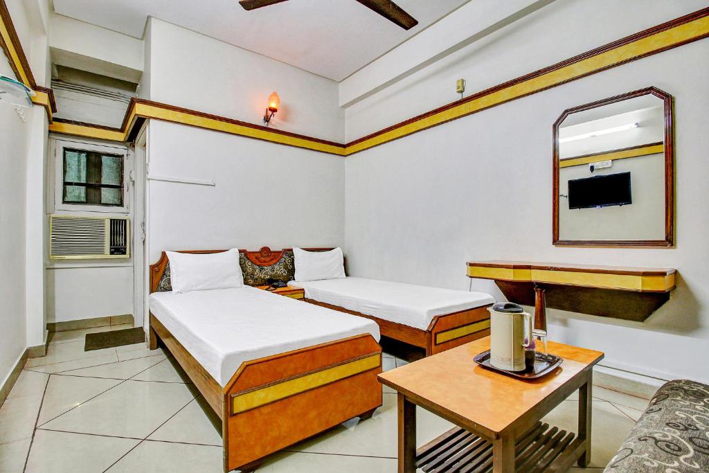 Postel nebo postele na pokoji v ubytování FabHotel Prime Manjeet