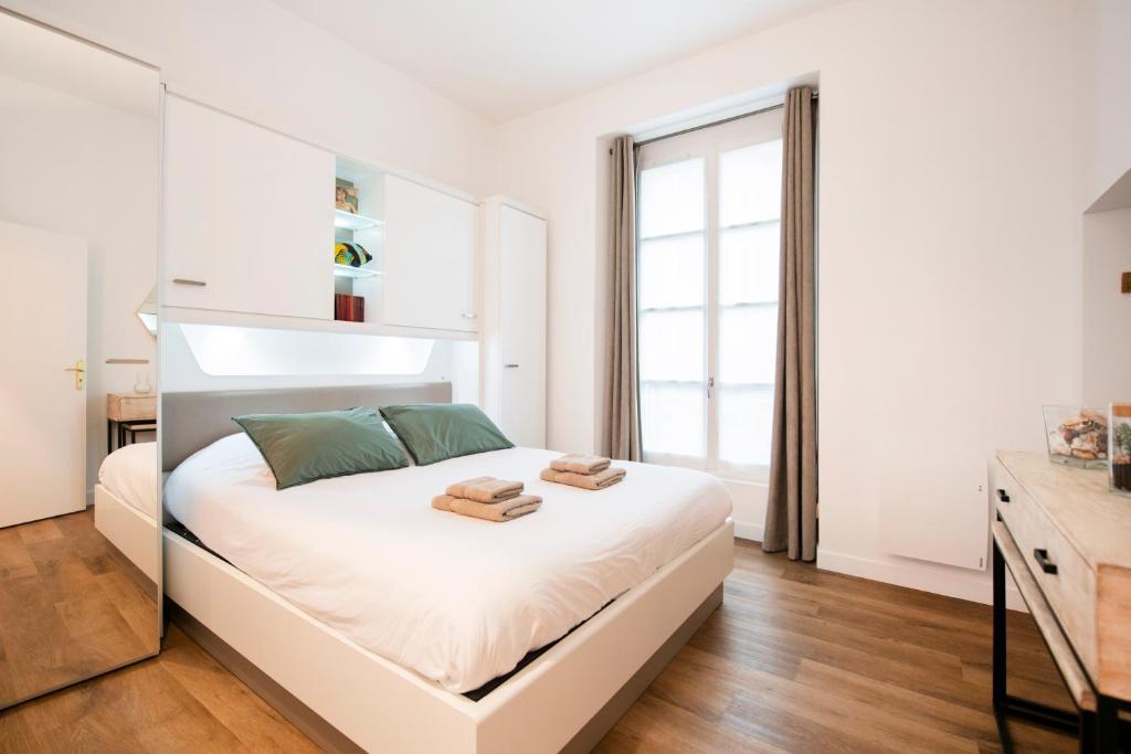 Postel nebo postele na pokoji v ubytování Le Laurencin Sens - Le Campagne