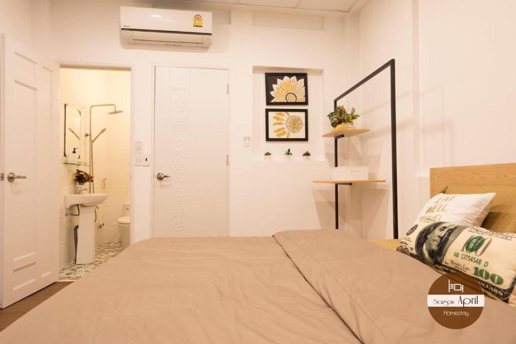 Postel nebo postele na pokoji v ubytování Saigon April Homestay