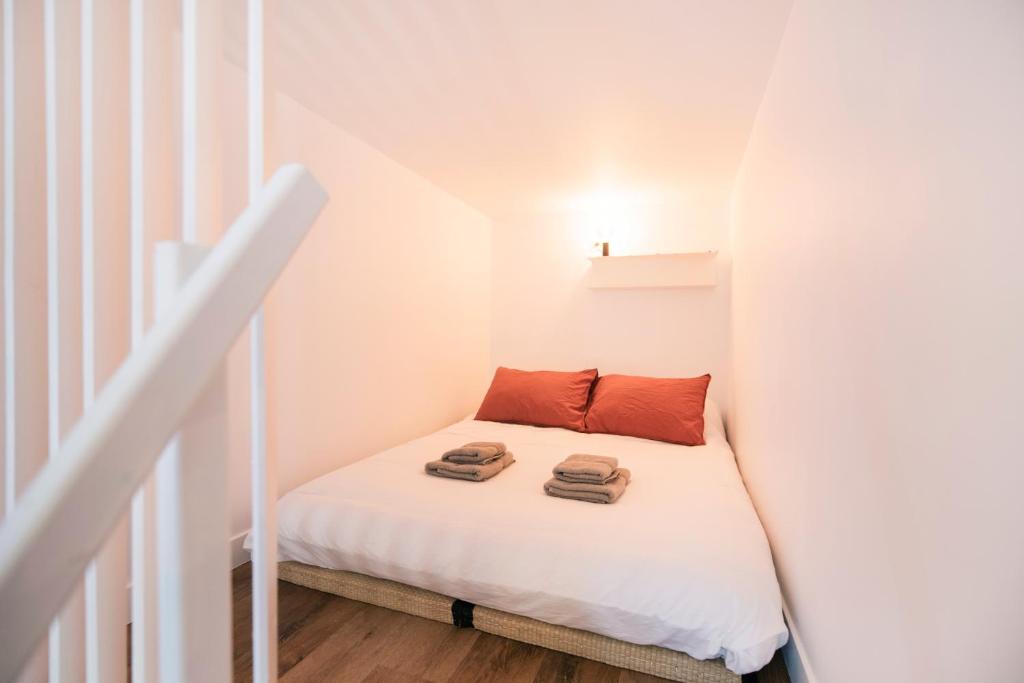 Postel nebo postele na pokoji v ubytování Le Laurencin Sens - La Mezzanine - Cœur de ville