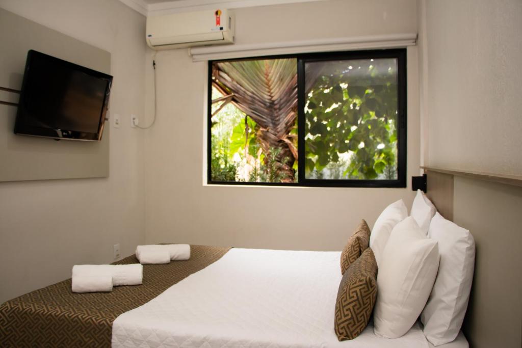 Postel nebo postele na pokoji v ubytování Iguassu Express Hotel