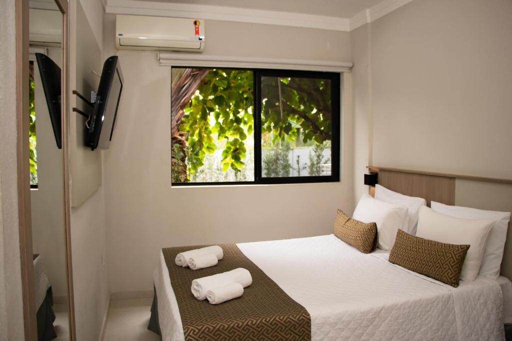 Postel nebo postele na pokoji v ubytování Iguassu Express Hotel