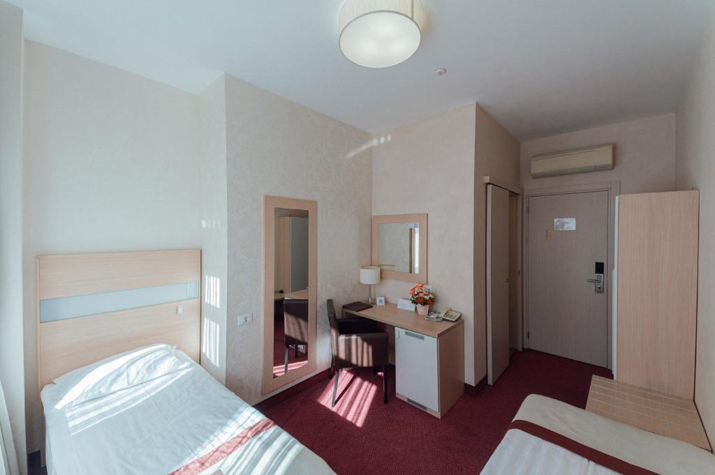 Postel nebo postele na pokoji v ubytování Boutique Hotel Palais Royal
