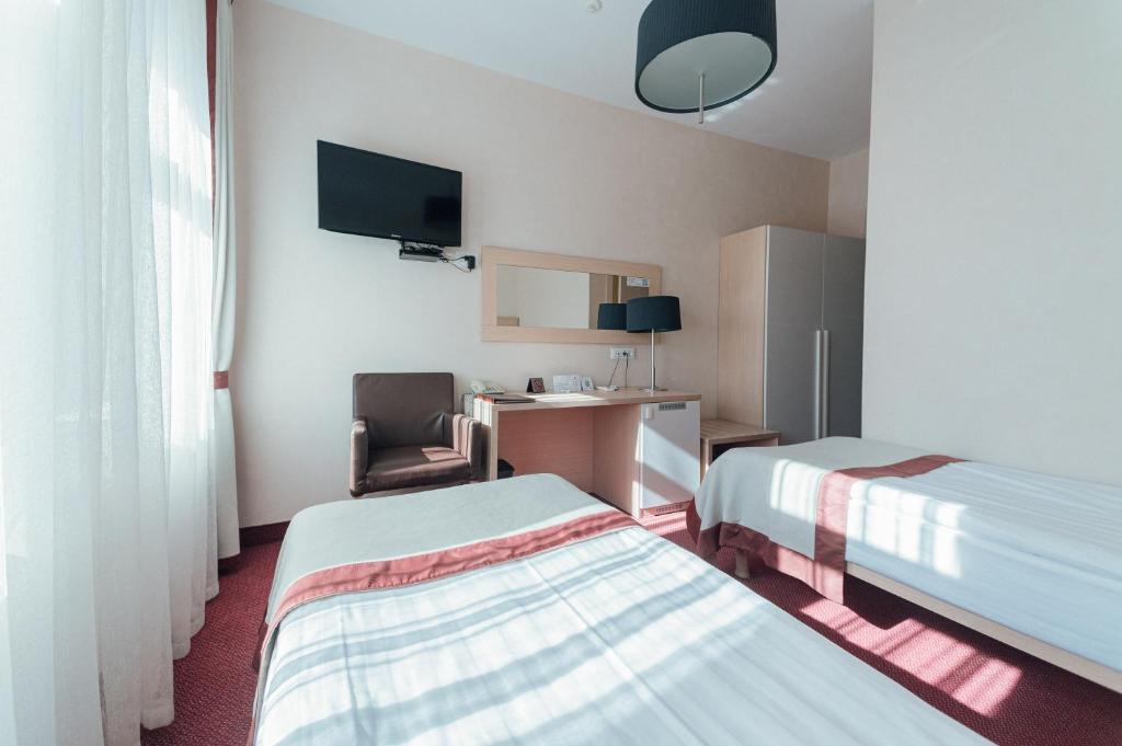 Postel nebo postele na pokoji v ubytování Boutique Hotel Palais Royal