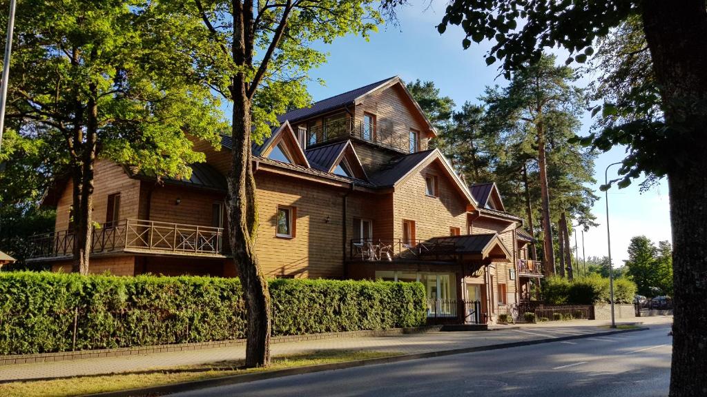a house on the side of a street at Hotel Vita in Druskininkai