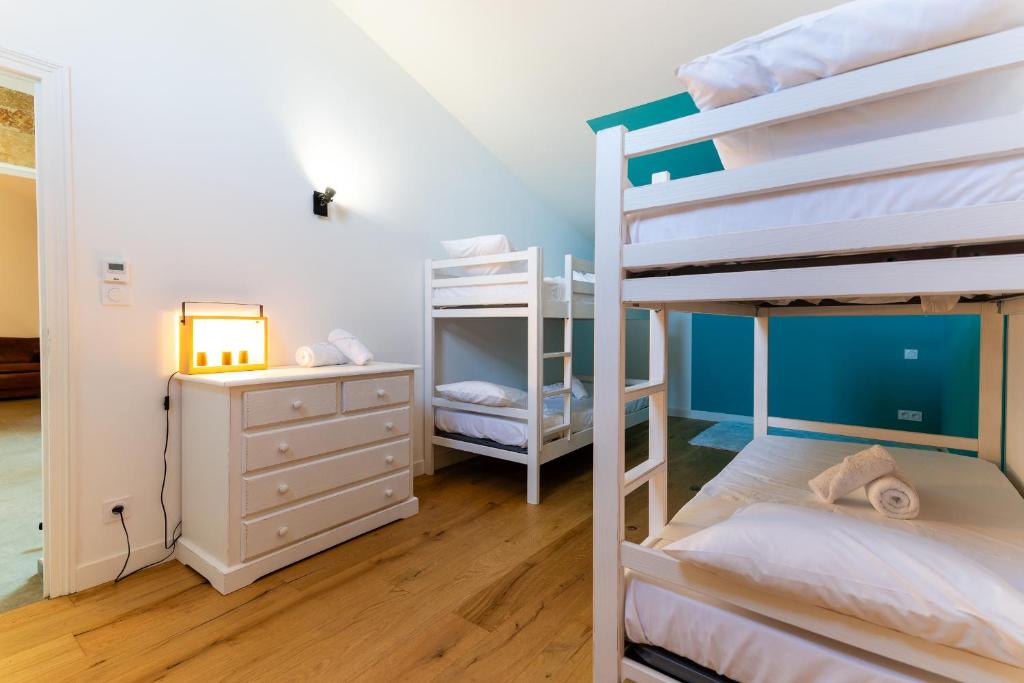 Postel nebo postele na pokoji v ubytování Mas Sureda - Evasion luxueuse avec vue panoramique