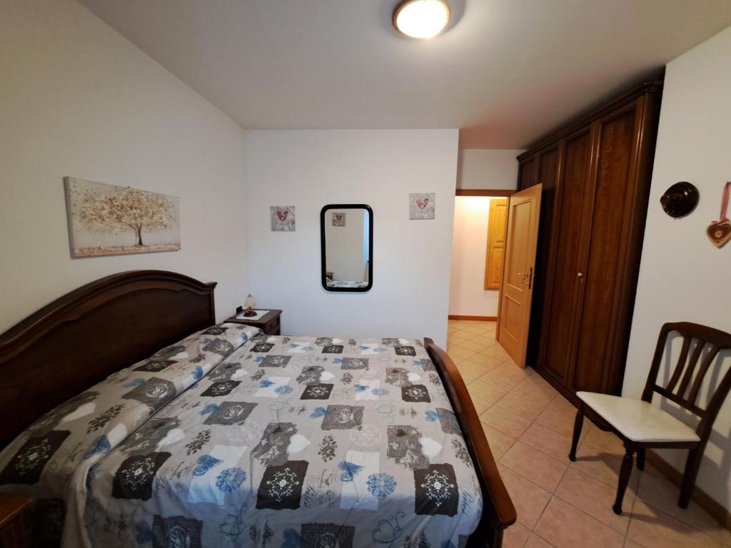 Postel nebo postele na pokoji v ubytování Appartamento panoramico a due passi dal Tonale