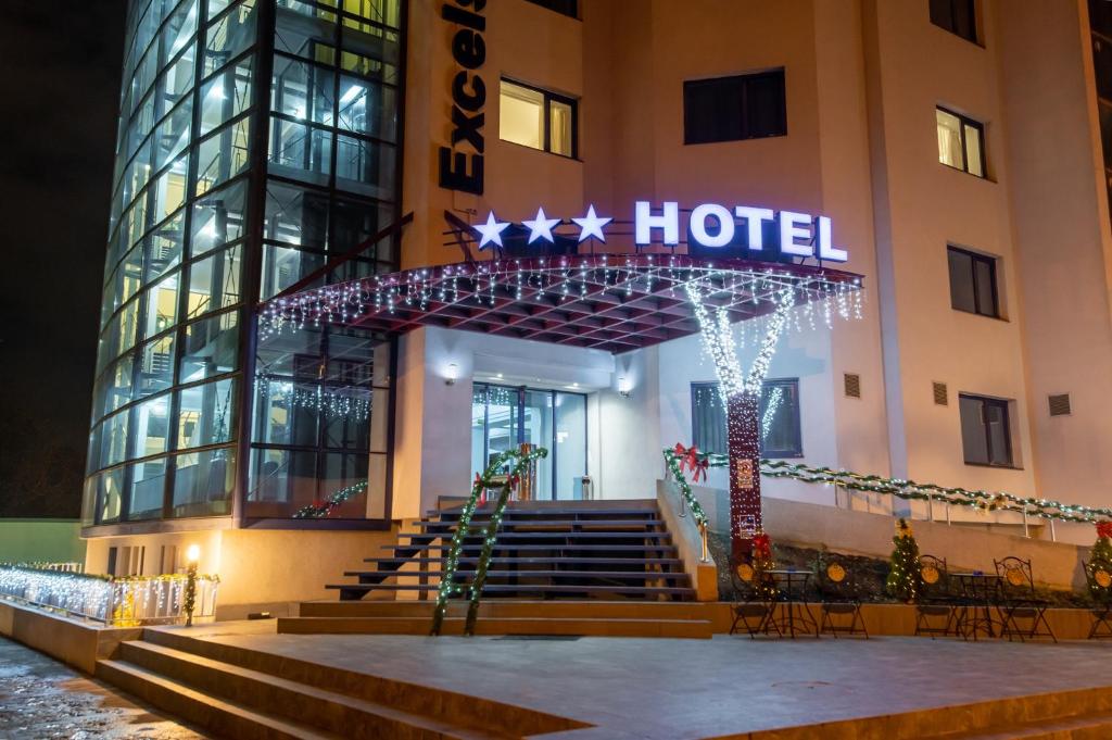 a hotel with a christmas sign on the front of it at Hotel Excelsior in Timişoara