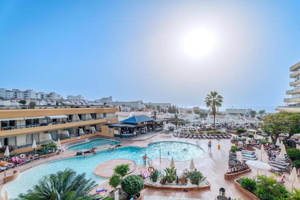 an overhead view of a pool at a resort at OBSIDIAN Estudio Santa María in Adeje