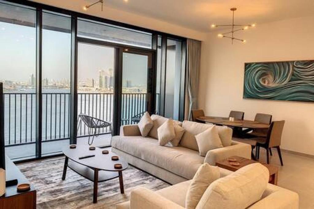 a living room with a couch and a table at Key View - Creek Edge T2 in Dubai