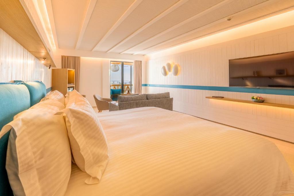 a hotel room with a large bed with pillows at The View Agadir in Agadir