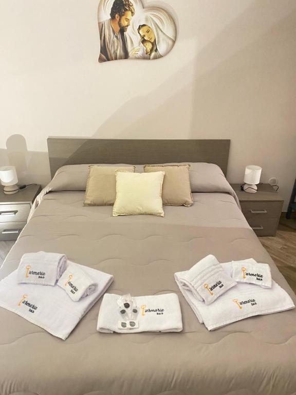 Postel nebo postele na pokoji v ubytování B&B L'Arenaria