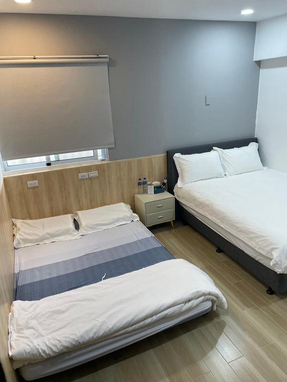 Llit o llits en una habitació de Happiness B&B
