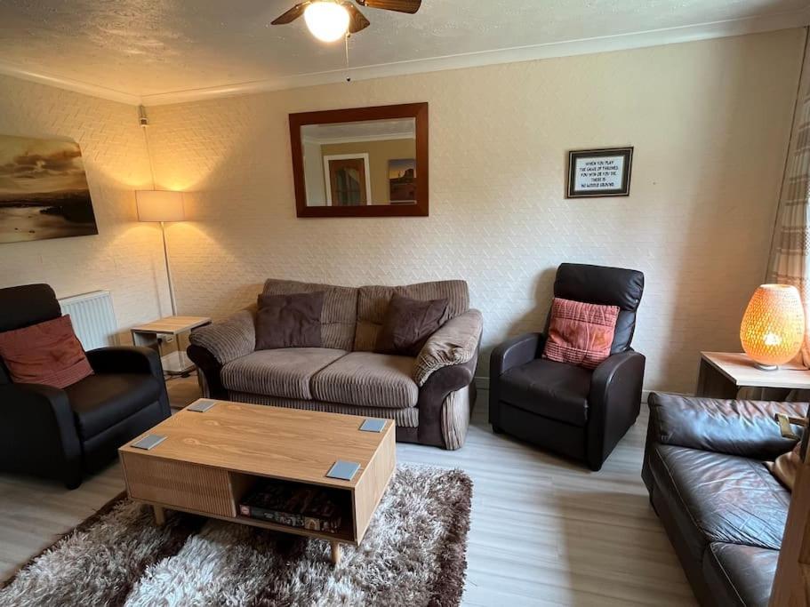 a living room with couches and a coffee table at Spacious home near Glasgow Green in Glasgow