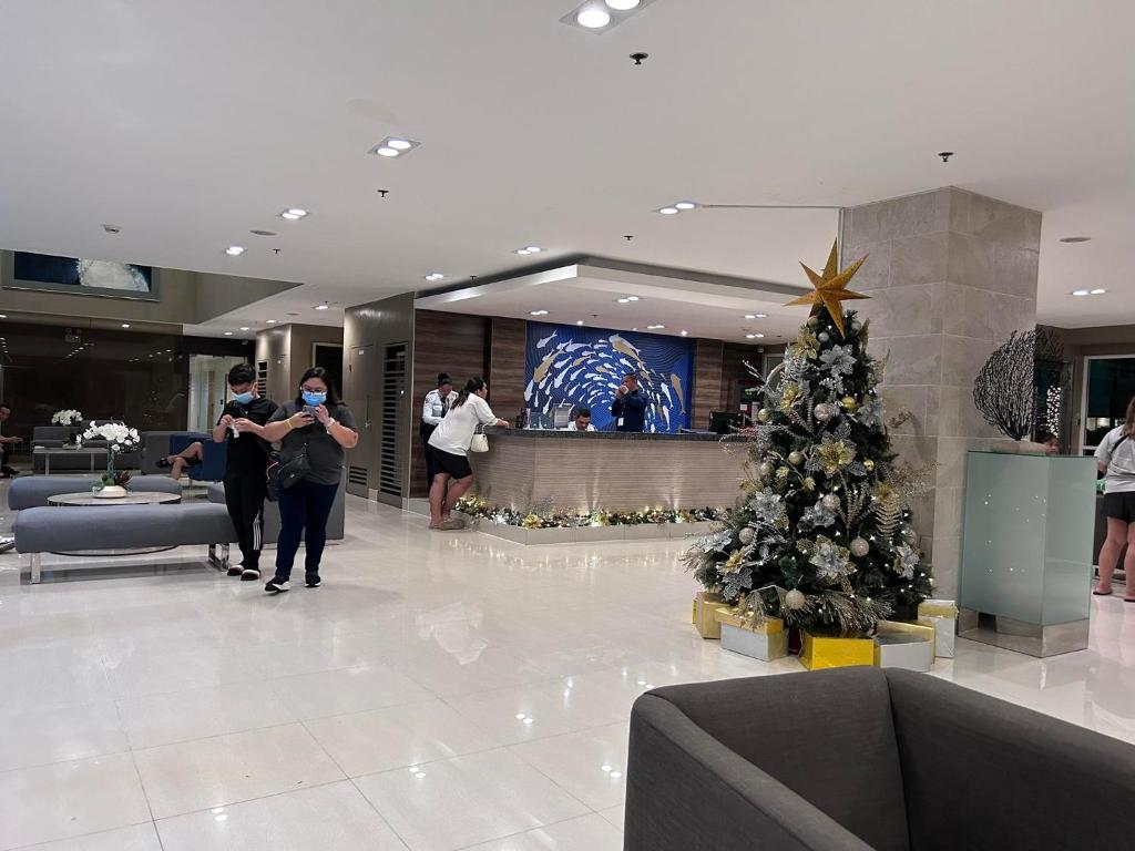 a christmas tree in the lobby of a hotel at King of kings in Manila