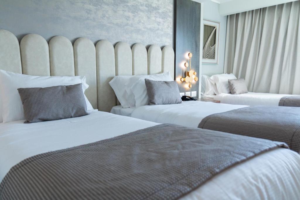Postel nebo postele na pokoji v ubytování Hotel HW High Wellness