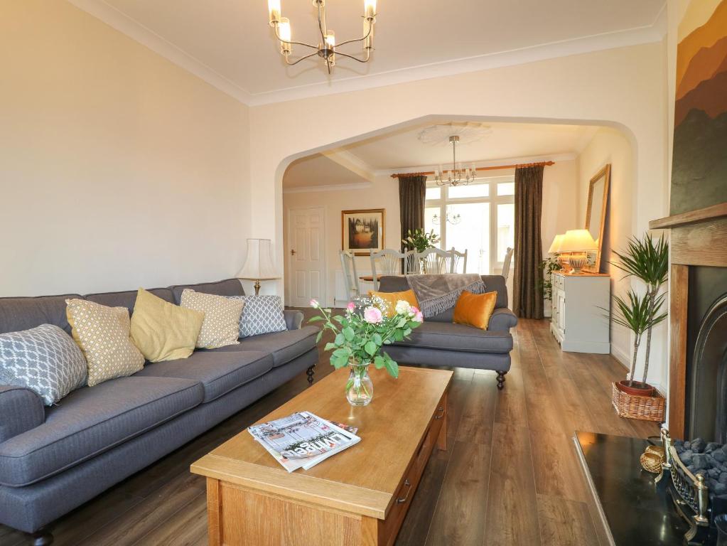 a living room with a couch and a table at 2 Gladstone Avenue in Melton Mowbray
