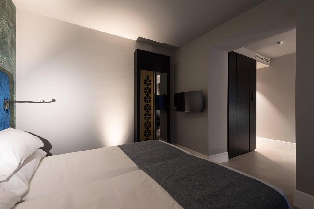 Boutique Hotel Cordial Maltesesにあるベッド