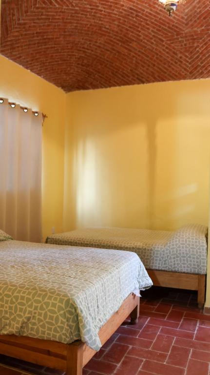 Postel nebo postele na pokoji v ubytování Posada La Mora - Hospedaje Panoramico