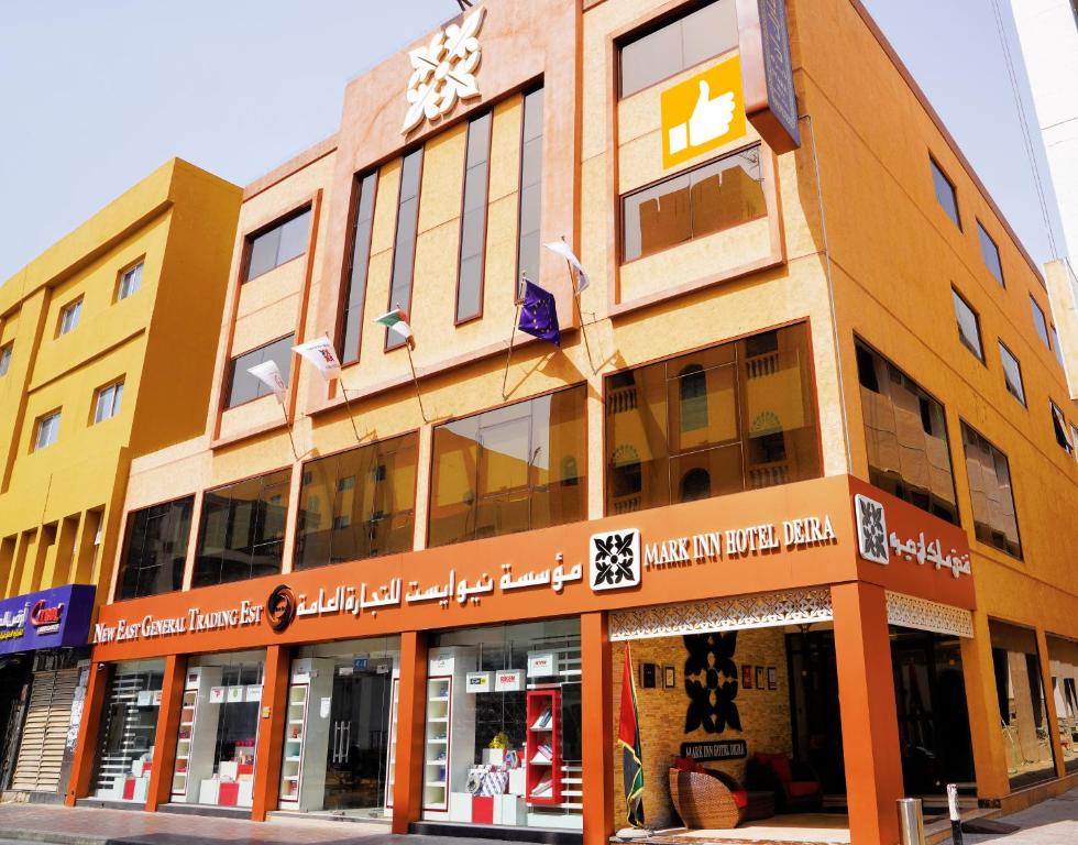 a building on the corner of a street at Mark Inn Hotel Deira in Dubai