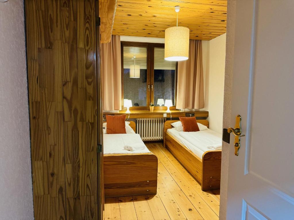 Postel nebo postele na pokoji v ubytování Hotel Nest