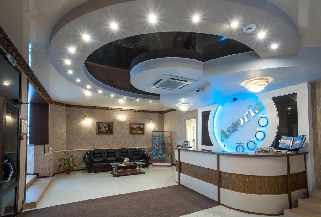 a lobby of a hotel with a waiting room at Hotel Astoria in Volgograd