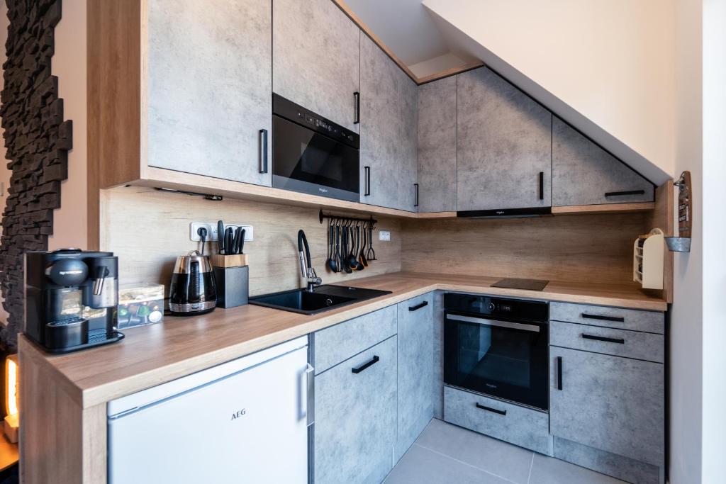 Kuchyň nebo kuchyňský kout v ubytování Apartmány u Sjezdovky