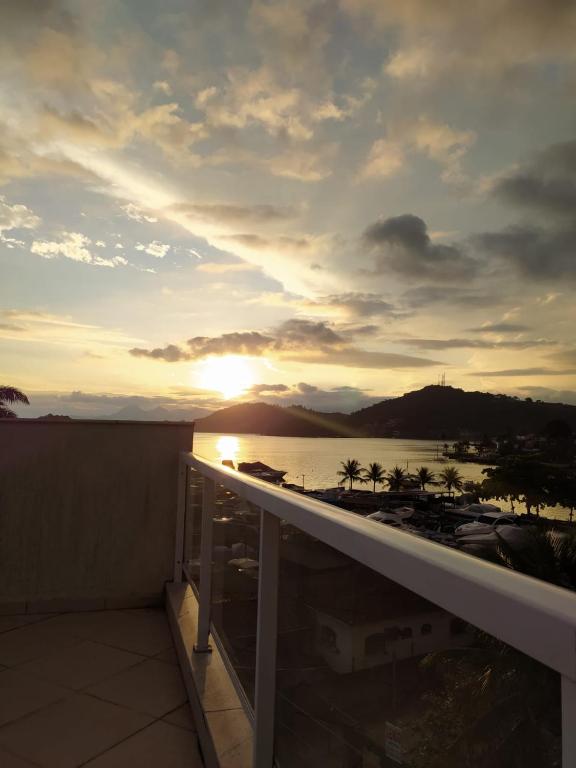 a view of the sunset from the balcony of a condo at Ribeira Guest House in Angra dos Reis